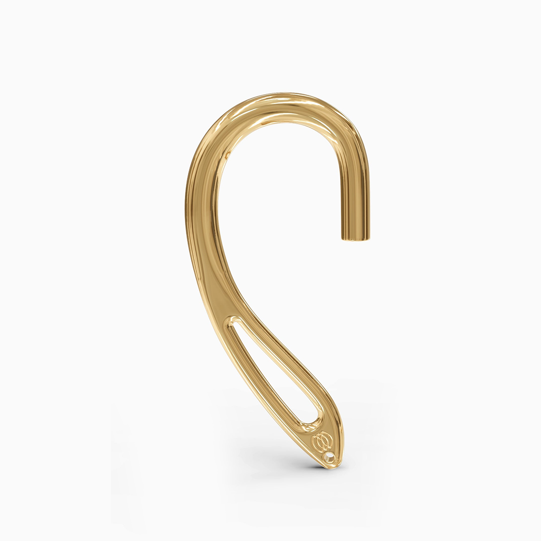 "Detailed view of the 24kt yellow gold interchangeable earcuff earring from Hearcuff Jewelry, highlighting the intricate design elements."