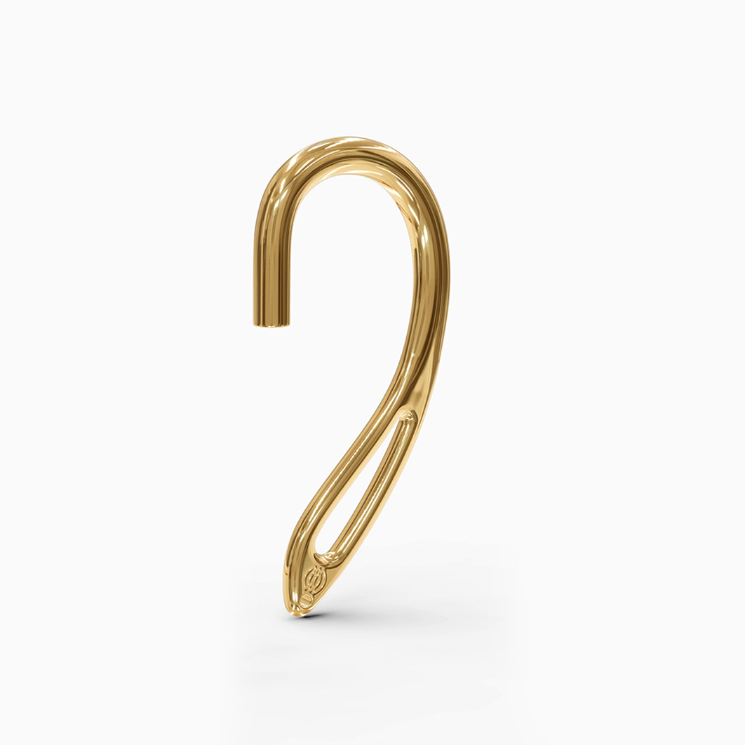 "Detailed view of the 24kt yellow gold interchangeable earcuff earring from Hearcuff, highlighting the intricate design elements."
